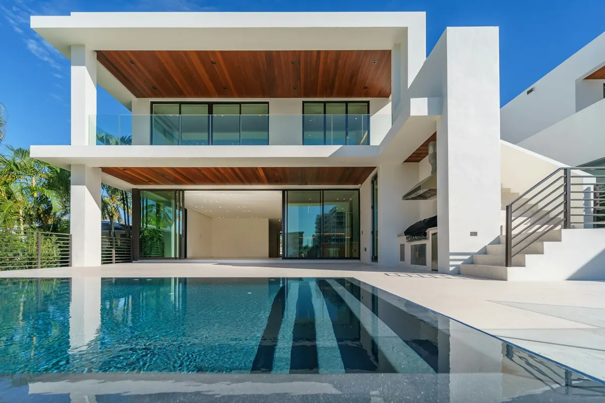 Rectangular pool beside a modern house