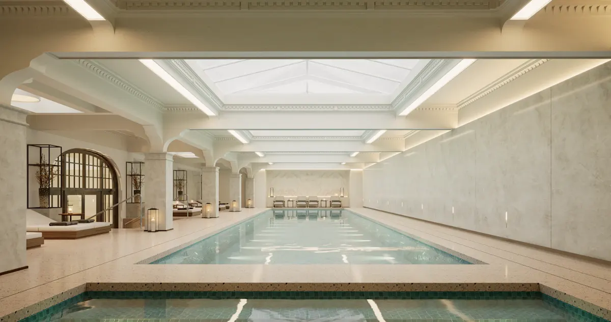 Indoor swimming pool with pale tile surrounds